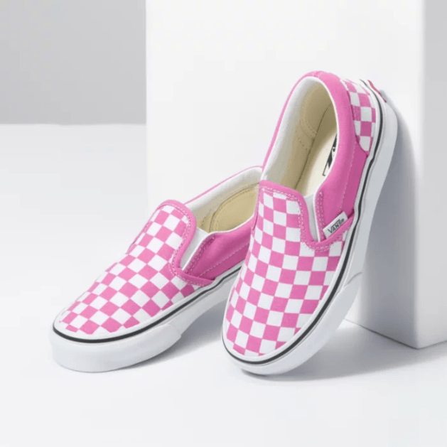 Pink checkerboard vans sales slip on